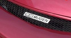 Эмблема (шильдик) решетки радиатора Mugen Audi A5 8T дорестайлинг, купе (2007-2011)