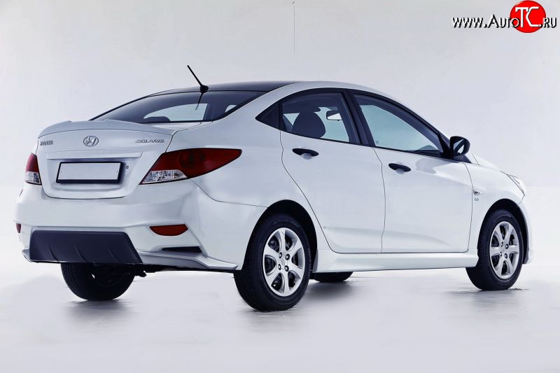 14 499 р. Задний бампер Sport  Hyundai Solaris  1 седан (2010-2014) (Неокрашенный)  с доставкой в г. Санкт‑Петербург