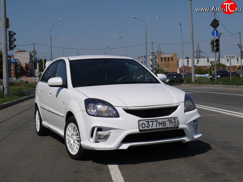 10 999 р. Передний бампер Vita Dm  KIA Rio ( 2 JB,  4 FB) (2005-2024) дорестайлинг седан, дорестайлинг, хэтчбэк 5 дв., рестайлинг, хэтчбэк 5 дв., рестайлинг седан (Без сетки, Неокрашенный)  с доставкой в г. Санкт‑Петербург